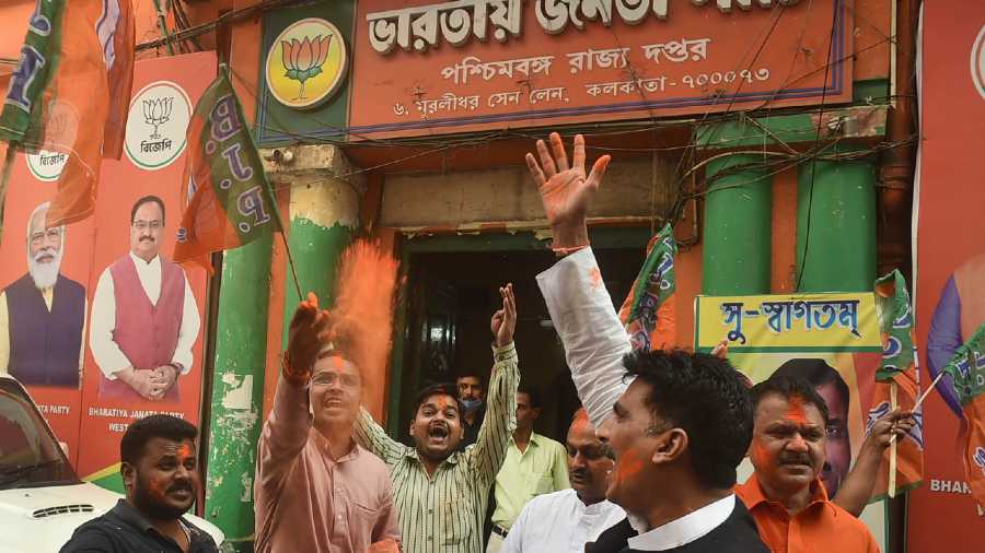BJP supporters celebrate their party's victory in Tripura Municipal Elections, outside state party office in Calcutta on Sunday.