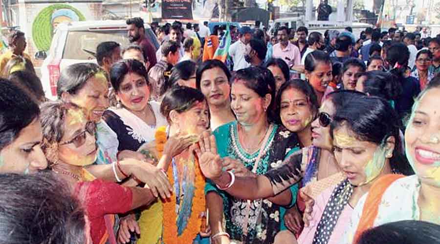 BJP workers celebrate the election results in Agartala on Sunday.