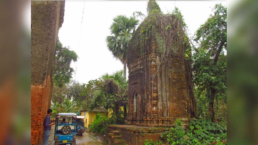 Several ivy and moss-covered abandoned brick temples are scattered all over the village