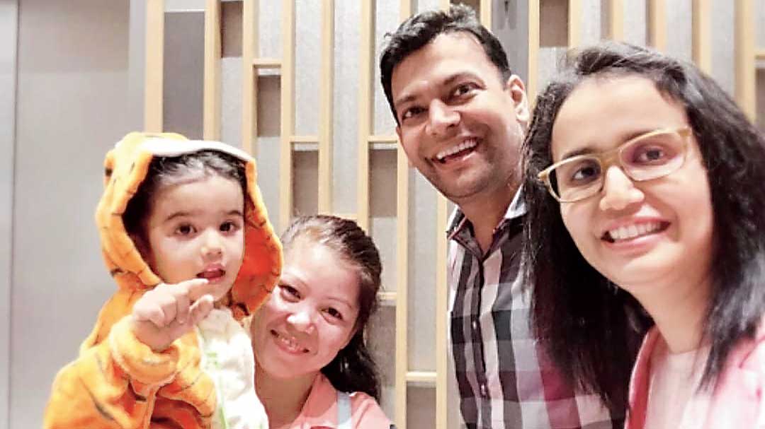 An earlier picture of Gaurav Baid and Rajshree Dugar with their daughter Aishani. The woman holding the kid is her caregiver Josie.