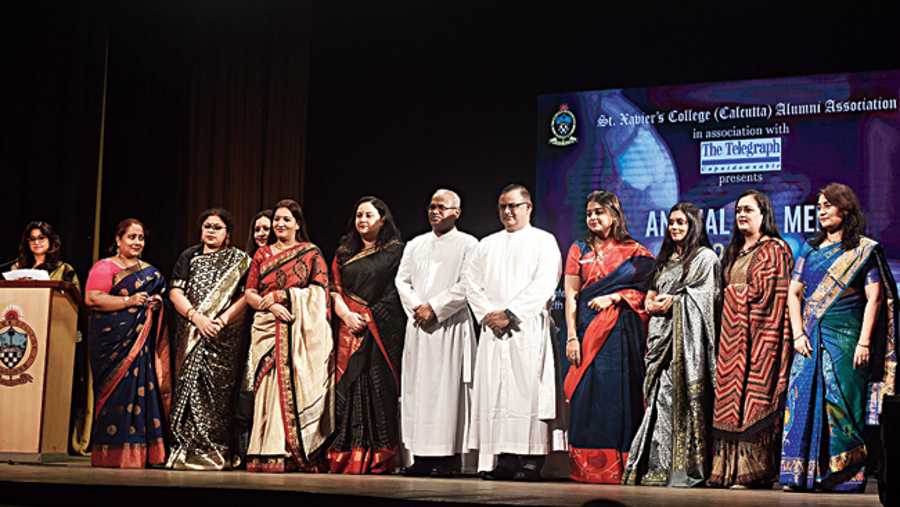 The members of the Women’s Forum of St. Xavier’s College (Calcutta) Alumni Association that hosted Annual Tea Meet 2021, with The Telegraph, posed along with Rev. Fr. Jeyaraj Veluswamy S.J. (centre; left), rector of St. X avier’s College and Rev. Fr. Dominic Savio S.J., principal of St. Xavier’s College. (L-R) Hasnu Mukherjee, Sanjukta Mehendiratta, Nupur Majumdar, Kavita Lohia, Darshita Trivedi, Sudeshna Roychowdhury, Sujata Rampuria, Ruchita Bajaj, Ritu Buvaria and Purnima Bothra. “The Annual Tea Meet is very close to our hearts where the Xaverian family comes together and strengthens the bond. This is the first event of our calendar year and its success shows us how the rest of the year is going to be,” said Darshita Trivedi, convener, Women’s Forum.