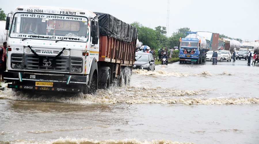Heavy vehicles on a flooded NH2 in Asansol on Thursday. 