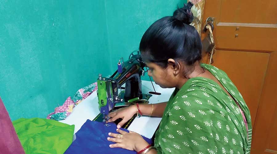 Manika Sumitra Patra stitches at her home in Tijala