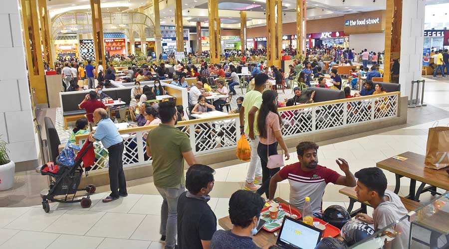 The packed food court of South City Mall on Sunday evening