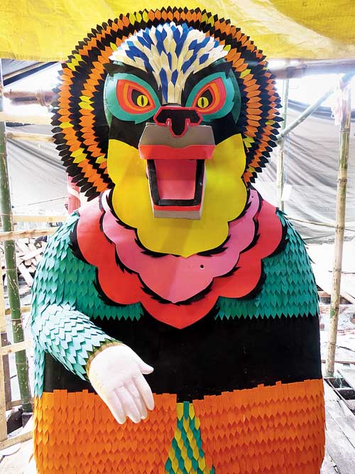 One of the asuras taking part in the churning of the sea at the pandal on the theme of samudramanthan.