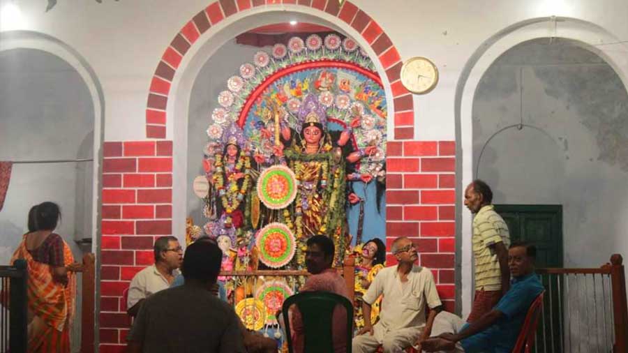 Family members gather at the 'thakur dalan'