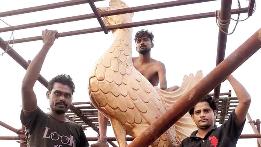 The weathercock being installed atop St Andrew’s Church at Dalhousie 