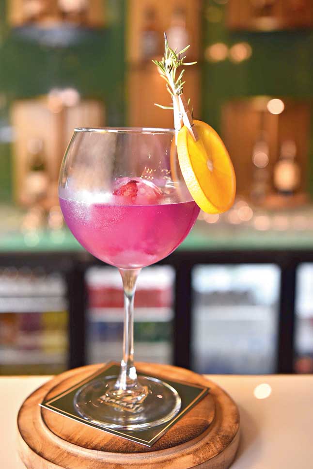 Royal Purple is a gin-based cocktail infused with herbs, like rosemary, lots of flowers and garnished with rose ice ball. Aromatic and smooth, this one is our faves!