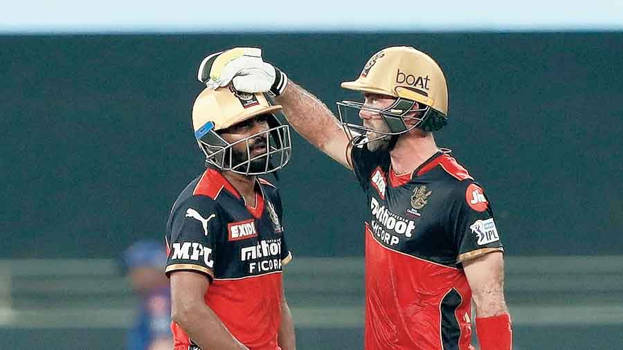 Match winners for RCB, Srikar Bharat and (right) Glenn Maxwell, during the game against Delhi Capitals in Dubai on Friday. 