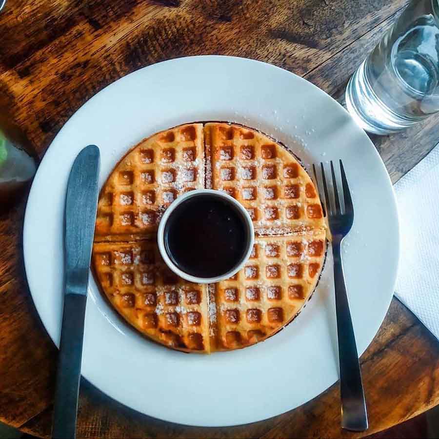 WAFFLES FROM THE COUNTRY HOUSE: Start Panchami with these crunchy waffles topped with berries, chocolate or even a dollop of whipped cream at this quaint cafe off Elgin Road. 