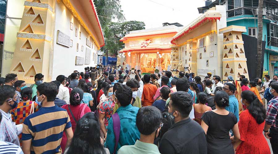 A crowded Tridhara puja pandal on Sunday evening. 