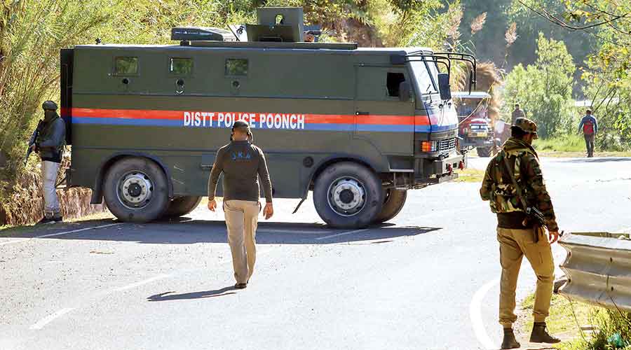 Security personnel stand guard at the encounter site at Bhatadurian in Poonch district on Friday. 