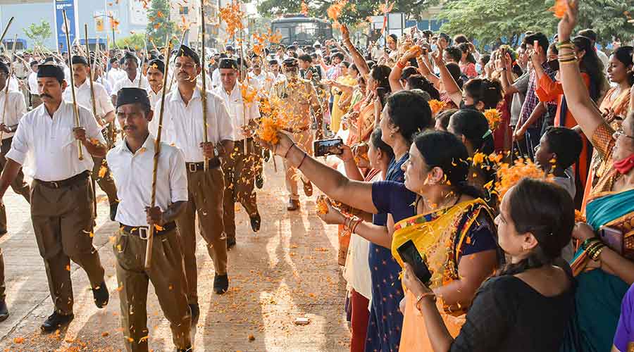 Volunteers participate in a RSS procession on Vijayadashami, in Hubballi on Friday, Oct. 15, 2021. 