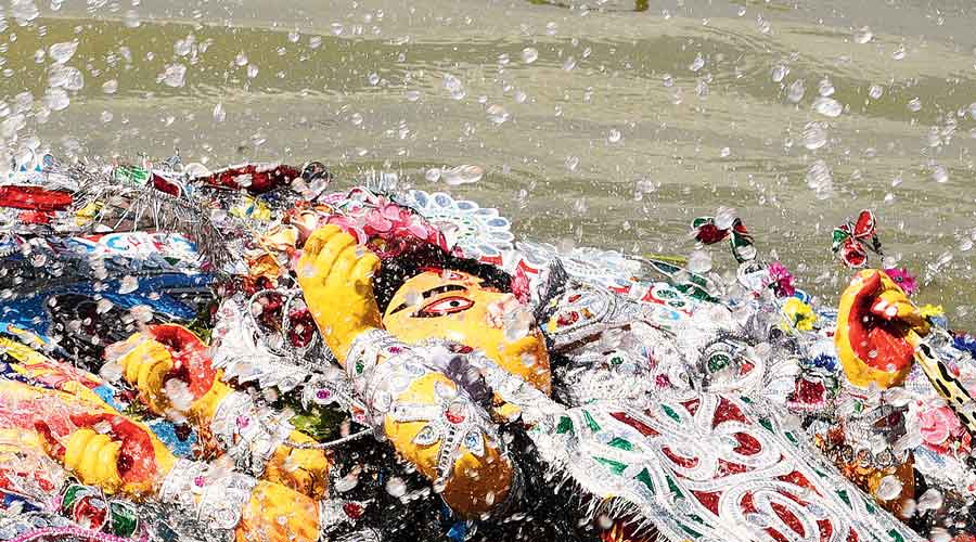 A Durga idol being immersed at Bagbazar ghat on Dashami afternoon.