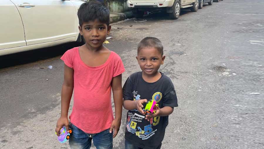 Badka with his brother and their toy cars