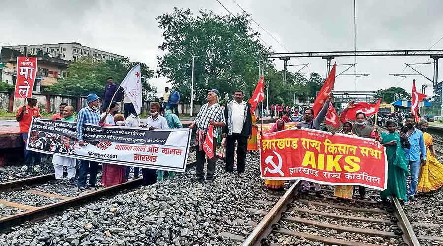 Farmers backed by the Left parties block the railway track near Namkum Station in Ranchi on Monday. 