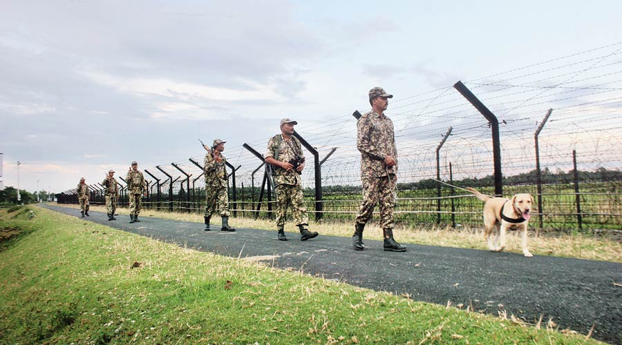 BSF troops patrol along the India-Bangladesh border near Siliguri. 