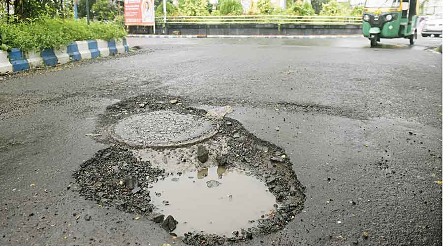 Huge craters on the road near Purta Bhavan.