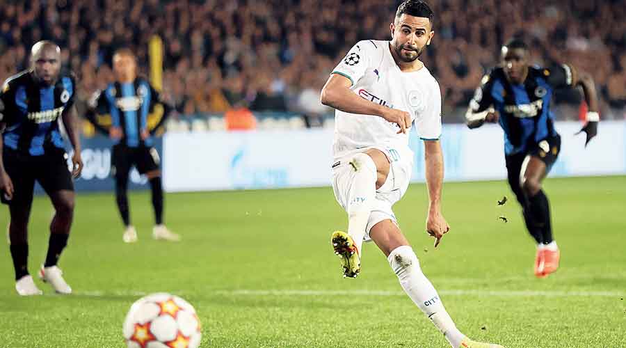 Riyad Mahrez scores his first and Manchester City’s second goal during their Champions League Group A match  against Club Brugge on Tuesday.