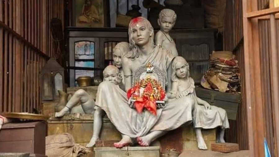 A statue of woman and children hold an idol of Goddess Durga, sit at a detention camp indicating NRC and CAA issues, at a community Durga Puja pandal in Kolkata, Saturday, Oct. 9, 2021.