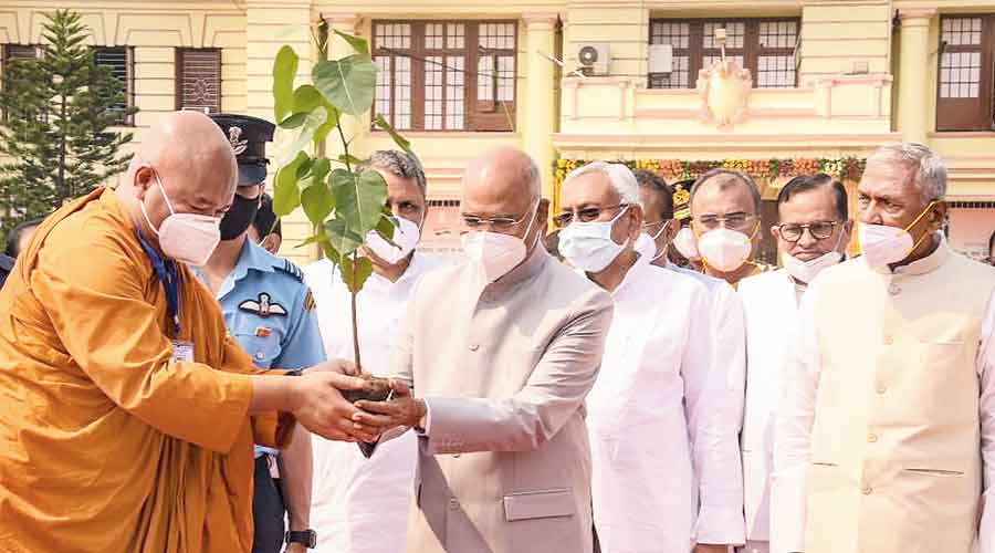President Ram Nath Kovind plants a Mahabodhi sapling on the premises of the Bihar Vidhan Sabha in Patna on  Thursday during the centenary celebrations of the Assembly building. Bihar governor Fagu Chauhan and chief minister Nitish Kumar are also seen.