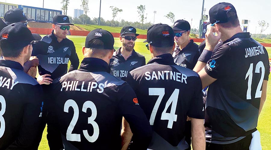 New Zealand captain Kane Williamson (centre) speaks to teammates during the warm-up match against England on Wednesday. 