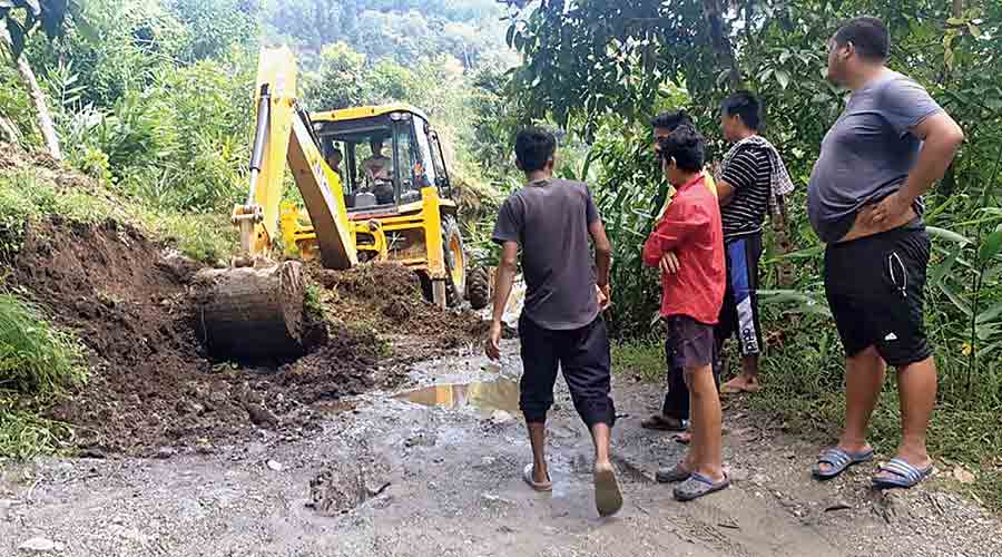 An earthmover engaged at Lingia in Darjeeling on Thursday to clear debris
