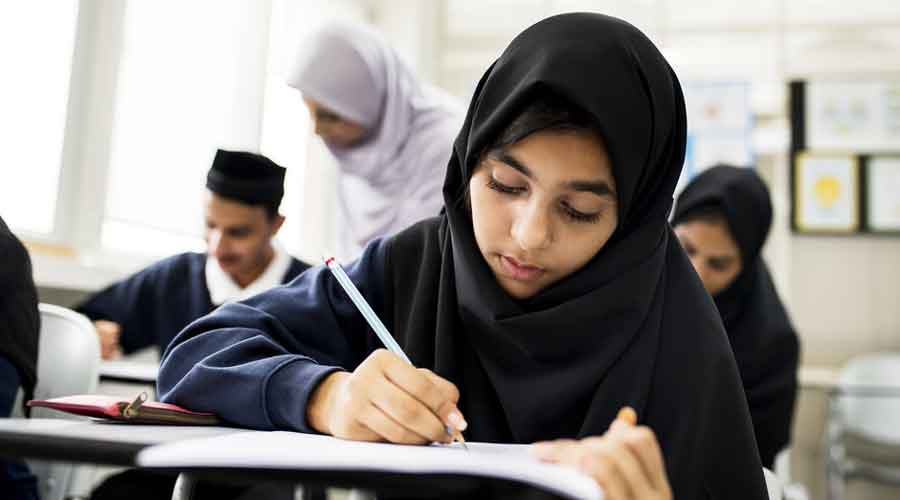 The teacher, Tamar Herman, has said that she brushed back the girl’s hooded sweatshirt because it was covering her eyes, unaware the girl was not wearing her usual hijab underneath.