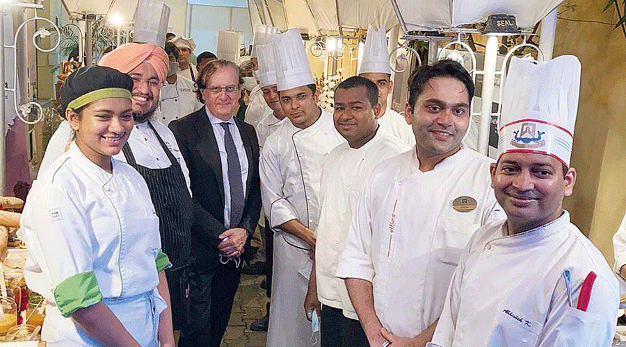 The consul general with the chefs who interpreted French cuisine for the guests on Thursday evening