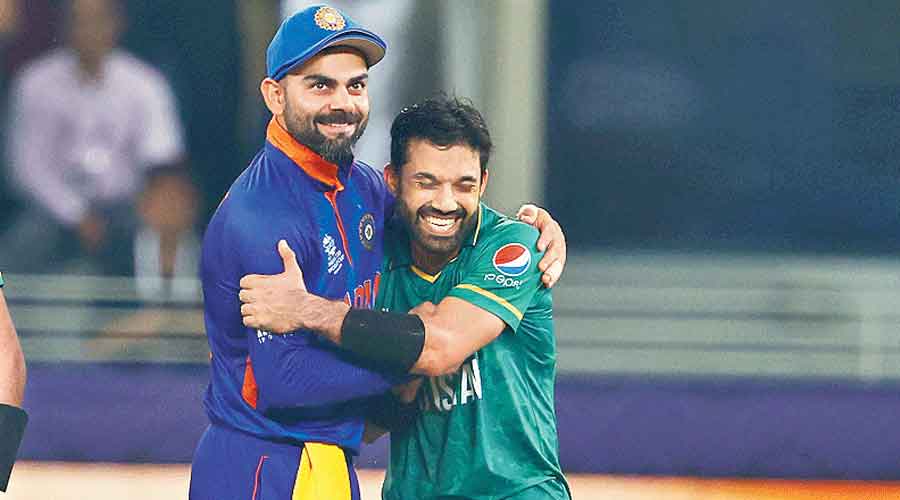 Virat Kohli with Pakistan’s Mohammad Rizwan after a 10-wicket loss for India in their opening T20 World Cup match in Dubai on Sunday.