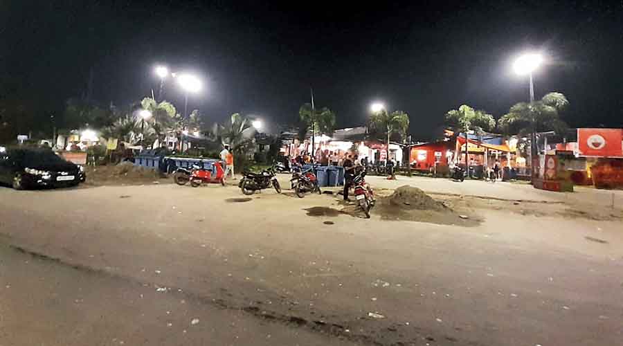Vehicles parked in front of eateries near the Unitech  bus stop in New Town after 11pm on Sunday.