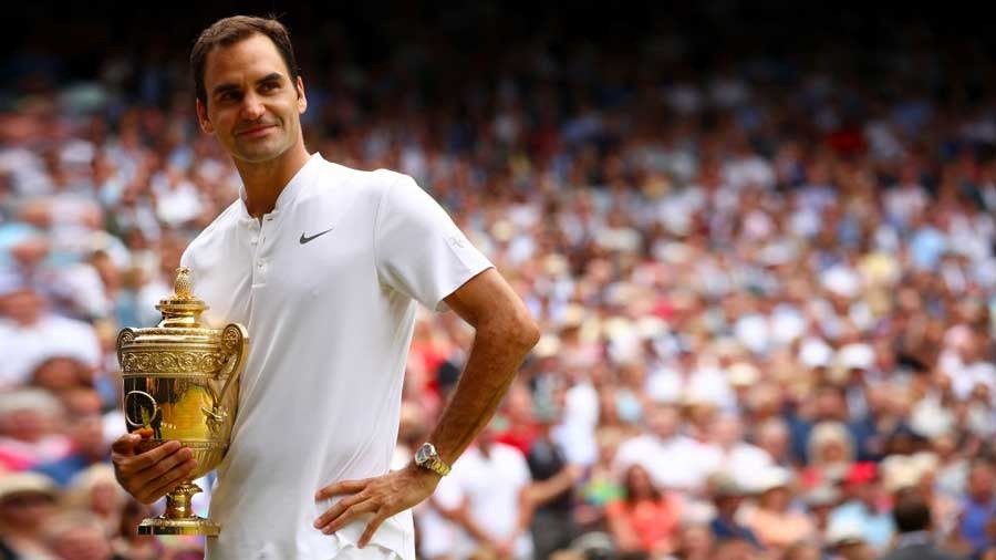 'Regular guy' Roger poses with the Wimbledon trophy
