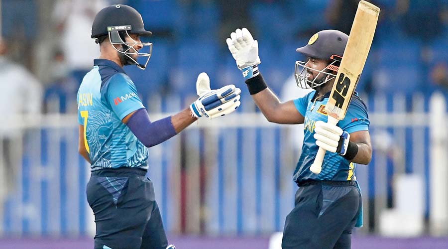 Dasun Shanaka and Charith Asalanka of Sri Lanka celebrate after defeating Bangladesh in Sharjah on Sunday. 