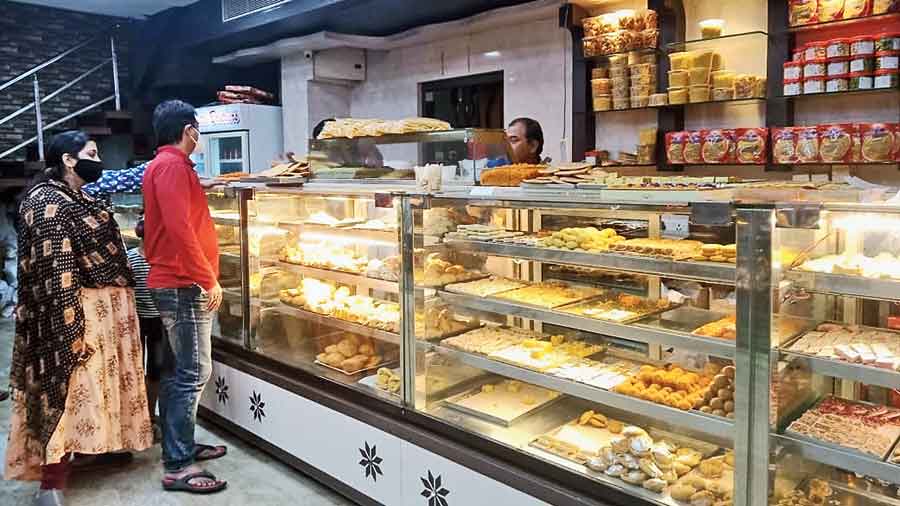 Customers place orders for dry fruits and sweets at the Gupta Brothers outlet near BF Block swimming pool
