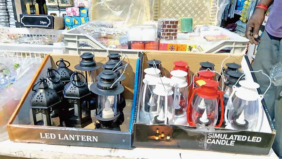 Electic lanterns shaped like hurricane lamps at Sri Guru Bhandar in IA Market