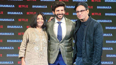 Ram Madhvani (right) with wife and co-producer Amita Madhvani and his Dhamaka leading man Kartik Aaryan at the trailer launch of the film last week.