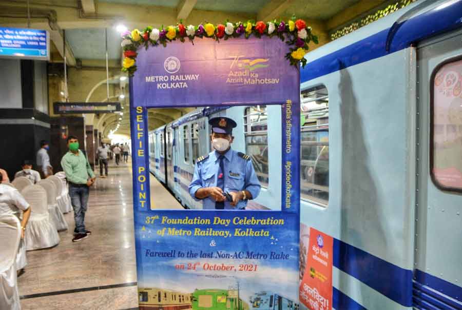 FAREWELL: A Metro Railway official poses for a photograph on Sunday, October 24, at Mahanayak Uttam Kumar station on the occasion of Kolkata Metro's 37th foundation day. On the occasion, Metro Railway bid farewell to its non-AC rakes. Some of these rakes had been in service since Kolkata Metro started operating in 1984. Now, all 28 rakes in operation are AC ones