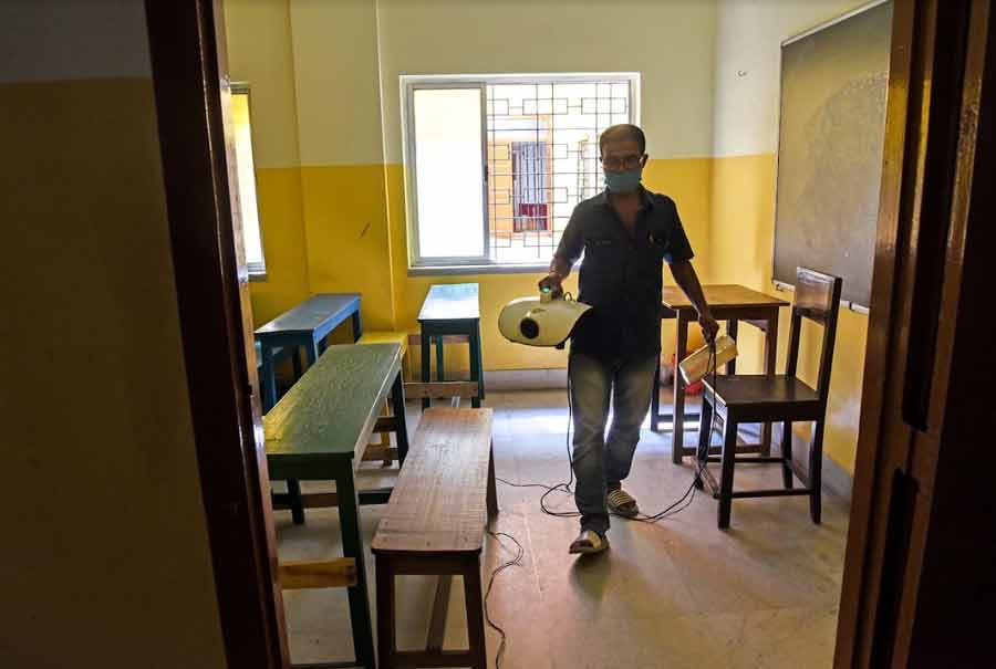 MISSION UNLOCK: A classroom being sanitised at a school near the Kolkata airport on Tuesday, October 26, after Bengal chief minister Mamata Banerjee announced that schools and colleges in the state will reopen for physical classes on November 16. Educational institutions were closed in March last year due to the Covid-19 pandemic