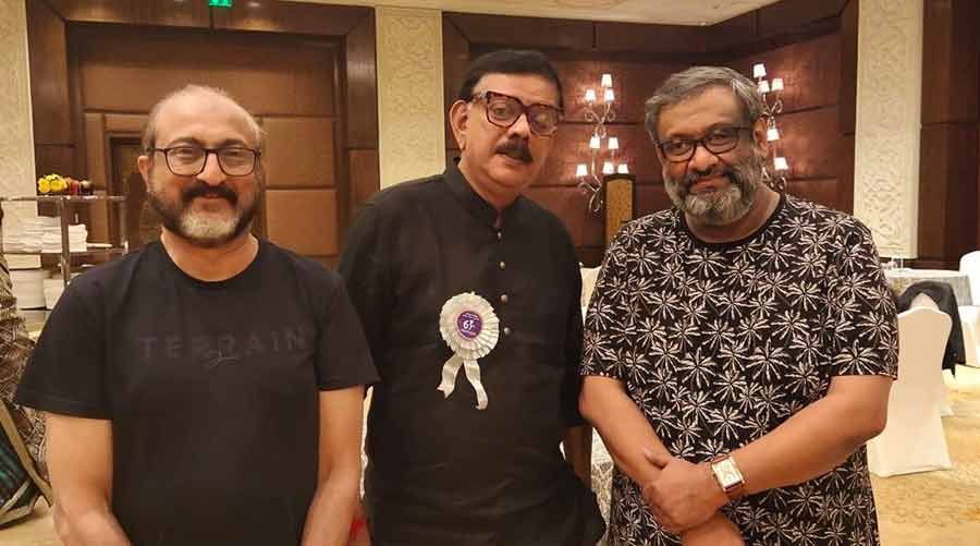 RECOGNITION: Film director Kaushik Ganguly (right) with music composer Prabuddha Banerjee (left) and film director Priyadarshan at the 67th National Film Awards function in Delhi last week. Kaushik Ganguly’s movie ‘Jyeshthoputro’ clinched national awards for best screenplay and best music direction