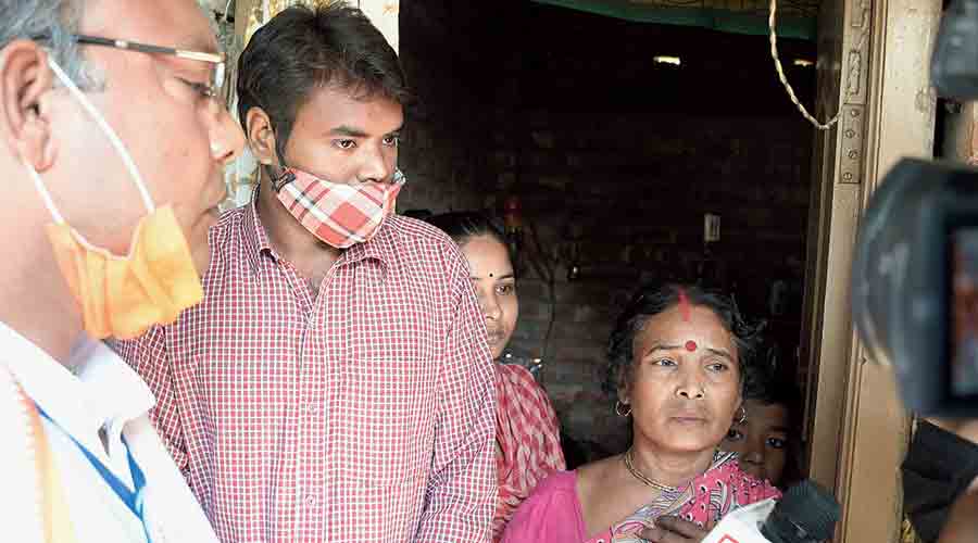 Madhabi Das and her BJP polling agent son Tapas in Santipur on Saturday.