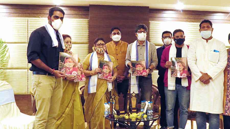 Members of Protect the Warriors with guests at the launch of the compilation Covid memoir at The Stadel on Sunday. To the left is actor-doctor Kinjal Nanda, while Shakuntala Barua is second from left and Pracheta Gupta, fifth from left