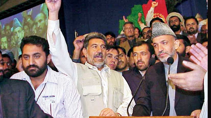 Hamid Karzai surrounded by supporters after his victory in the loya jirga in Kabul in 2002.