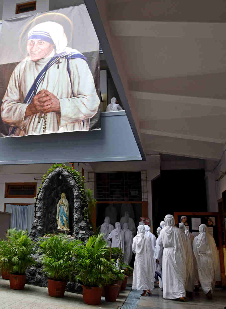 PROTECT US: A giant-sized portrait of Mother Teresa hangs across two floors at Mother House. 