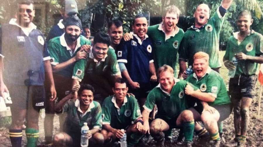 Paul Walsh (far right, front row) along with Gary Stilgoe (second from right, back row) and John Hamilton (third from right, back row) after a match