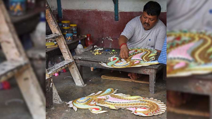 An artisan prepares accessories for the idols in Kumartuli last month