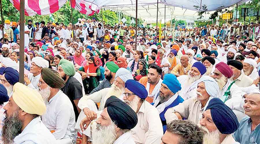 Farmers during their sit-in in Karnal on Thursday.