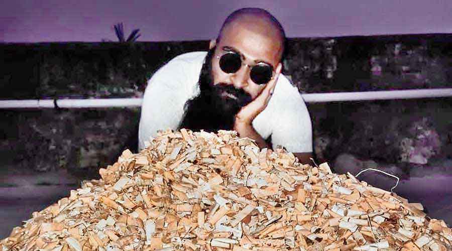 Nirit Datta rests on a heap of cigarette butts