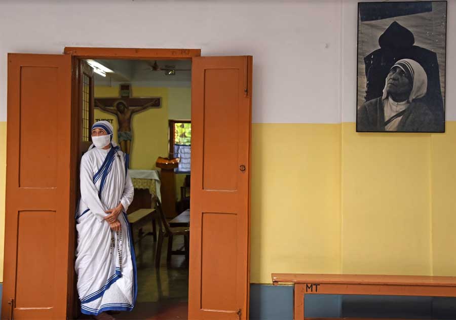 MOTHER'S ABODE: A nun of the Missionaries of Charity at the Mother House in central Kolkata on Sunday, September 5, Mother Teresa’s 24th death anniversary. Besides tributes and prayers, nuns at the Mother House distributed food among the poor on the occasion