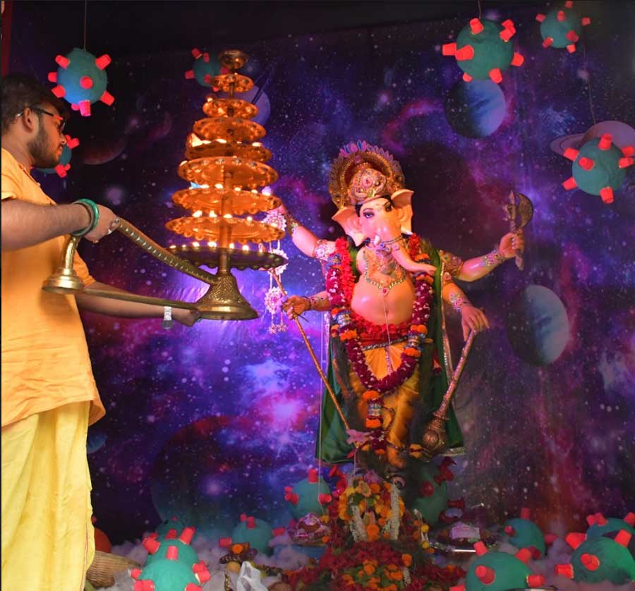 PRAYERS IN PANDEMIC: A priest performs rituals at a coronavirus-themed Ganesh puja on Rakhal Mukherjee Road in south Kolkata on Friday, September 10