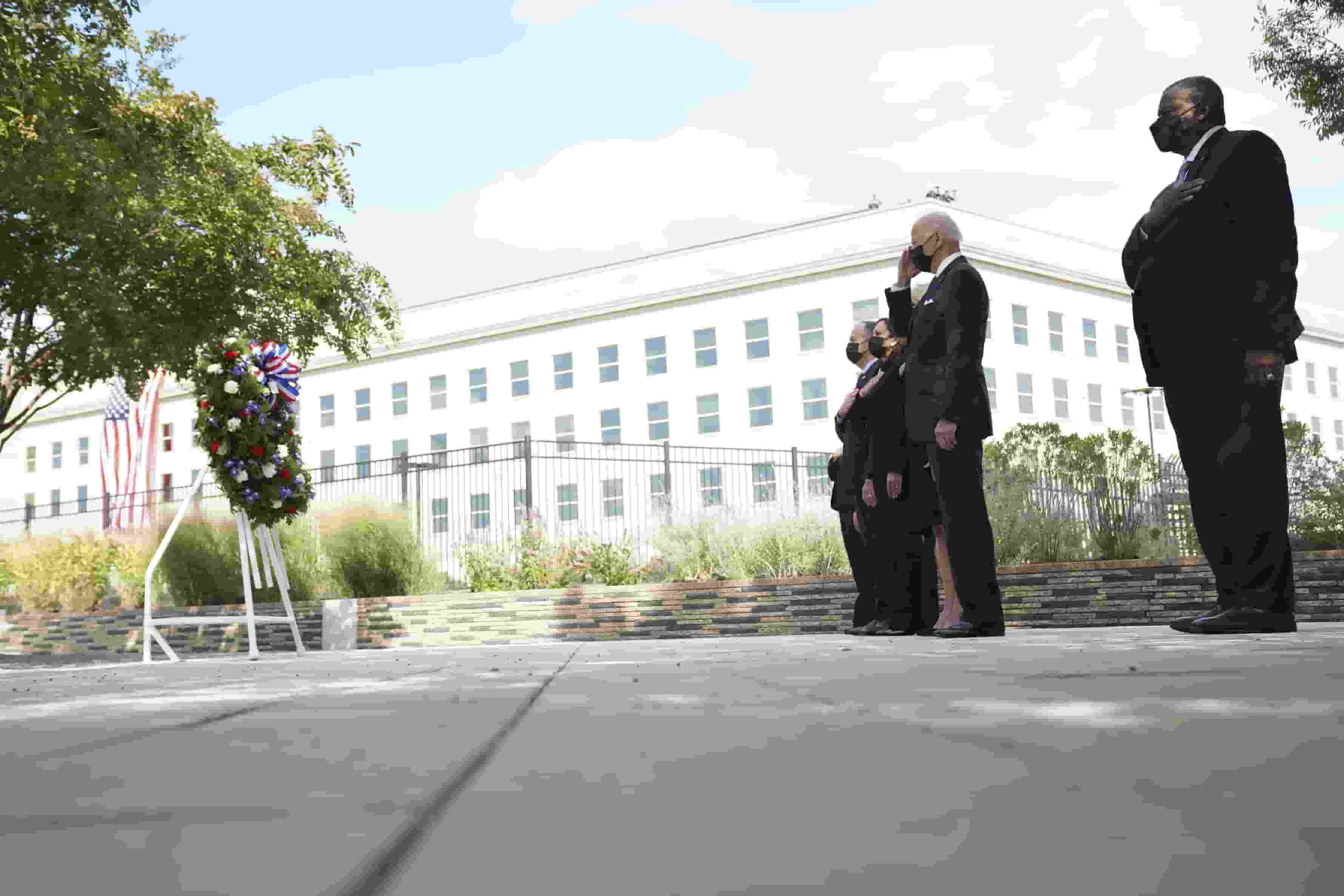 President Joe Biden and first lady Jill Biden, joined by Vice President Kamala Harris and second gentleman Doug Emhoff, present a wreath at the Pentagon on the 20th anniversary of the September 11 attacks, in Arlington.